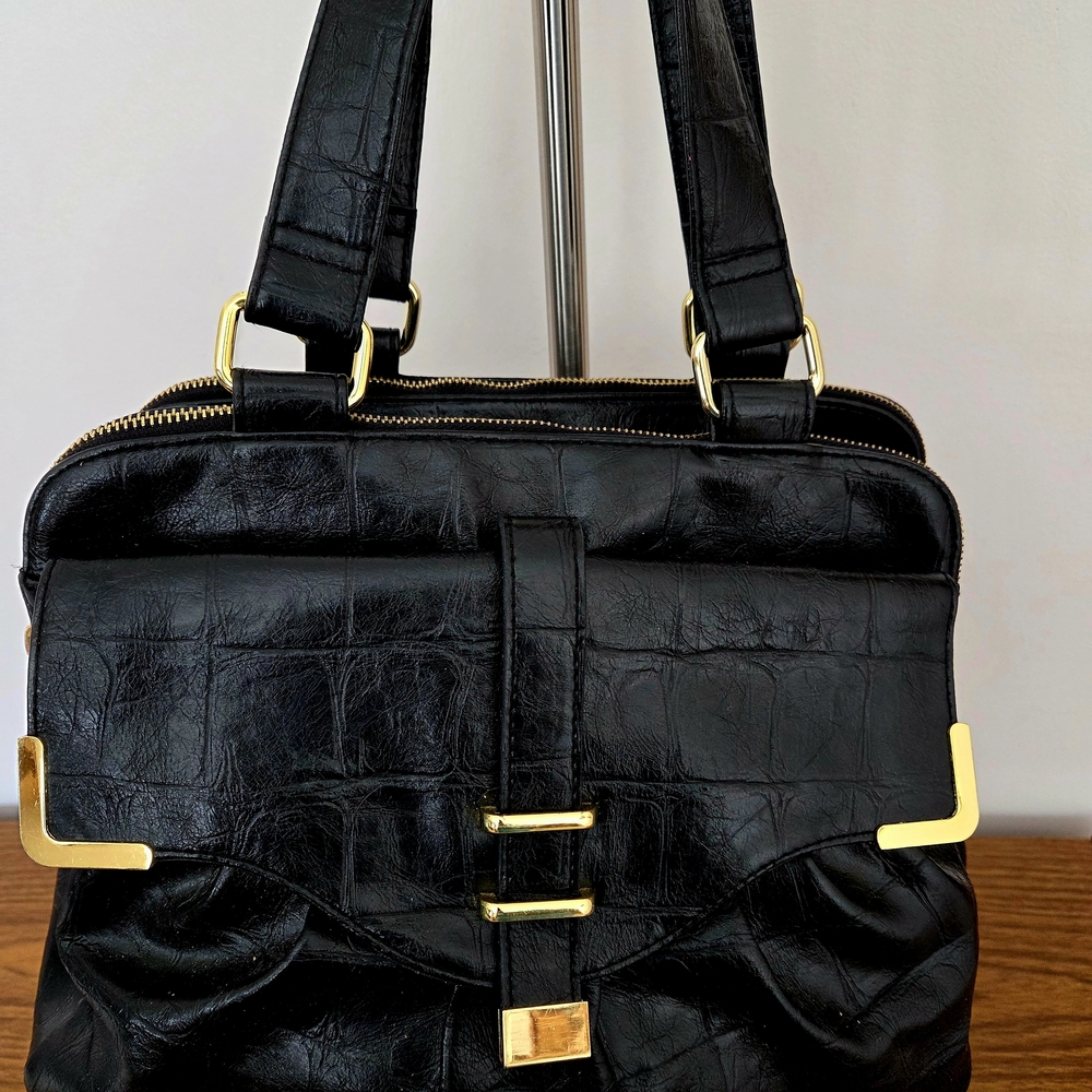 Elegant Black Leather Handbag with Gold Accents